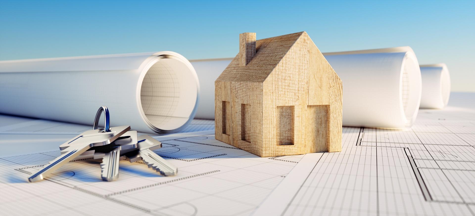 Hausbauplanung mit Modell und Schlüsseln | Terrassenüberdachung Hamburg